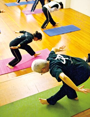 An integral tai chi class practices the ancient form.
