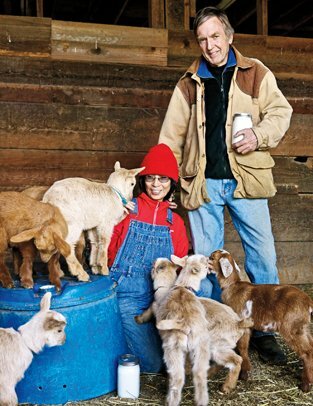 Mike and Jane Hulme with the kids of Evergreen Acres goat farm at their new location in Hollister.